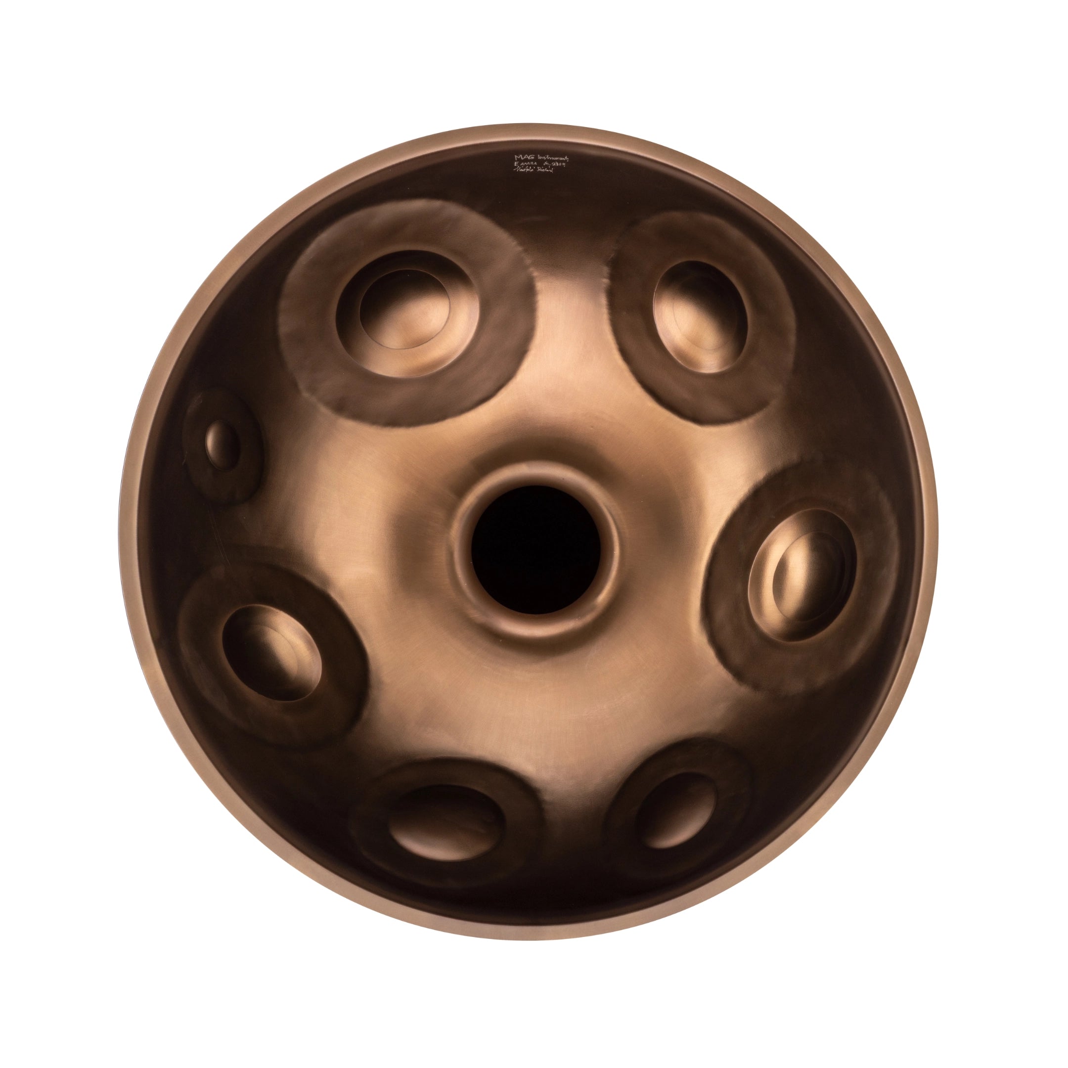The MAG E Amara 20 by Yatao // Shop is a metallic handpan drum with a central hole and circular tone fields, shown in a top-down photo on a white background.