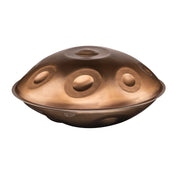 The Yatao // Shop MAG E Amara 20 is a metallic handpan with a dome-like shape and multiple circular indentations, displayed against a plain white background.