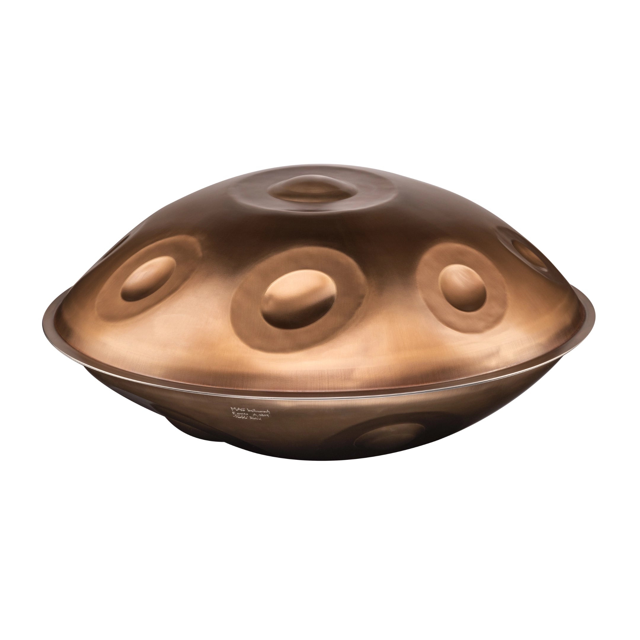 The Yatao // Shop MAG E Amara 20 is a metallic handpan with a dome-like shape and multiple circular indentations, displayed against a plain white background.