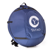 The Namana Handpan Bag Namana Softcase is a round blue bag with shoulder straps and a front pocket, featuring a white stylized Y logo inspired by Yatao Handpan.