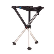 The Walkstool Handpan stool by Walkstool features a lightweight design, collapsible three silver legs, and a fabric seat for easy folding and carrying—ideal for outdoor use.