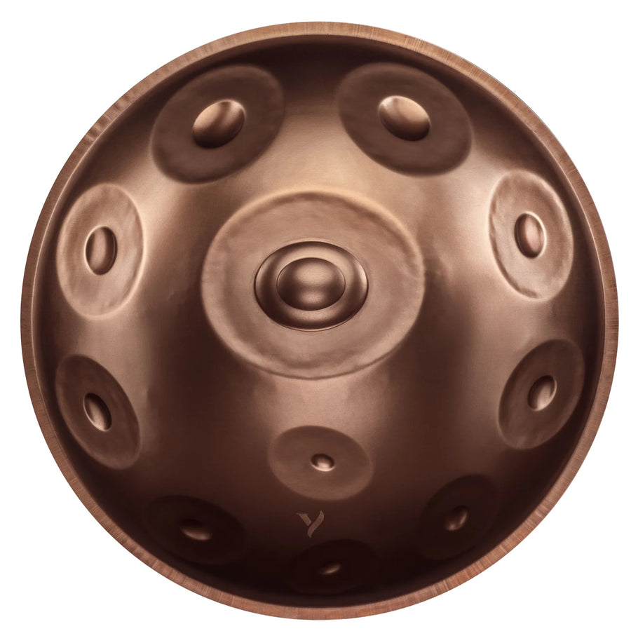 Yatao D Kurd 11 beginner handpan with 11 notes, bronze finish, top view, ion a white background