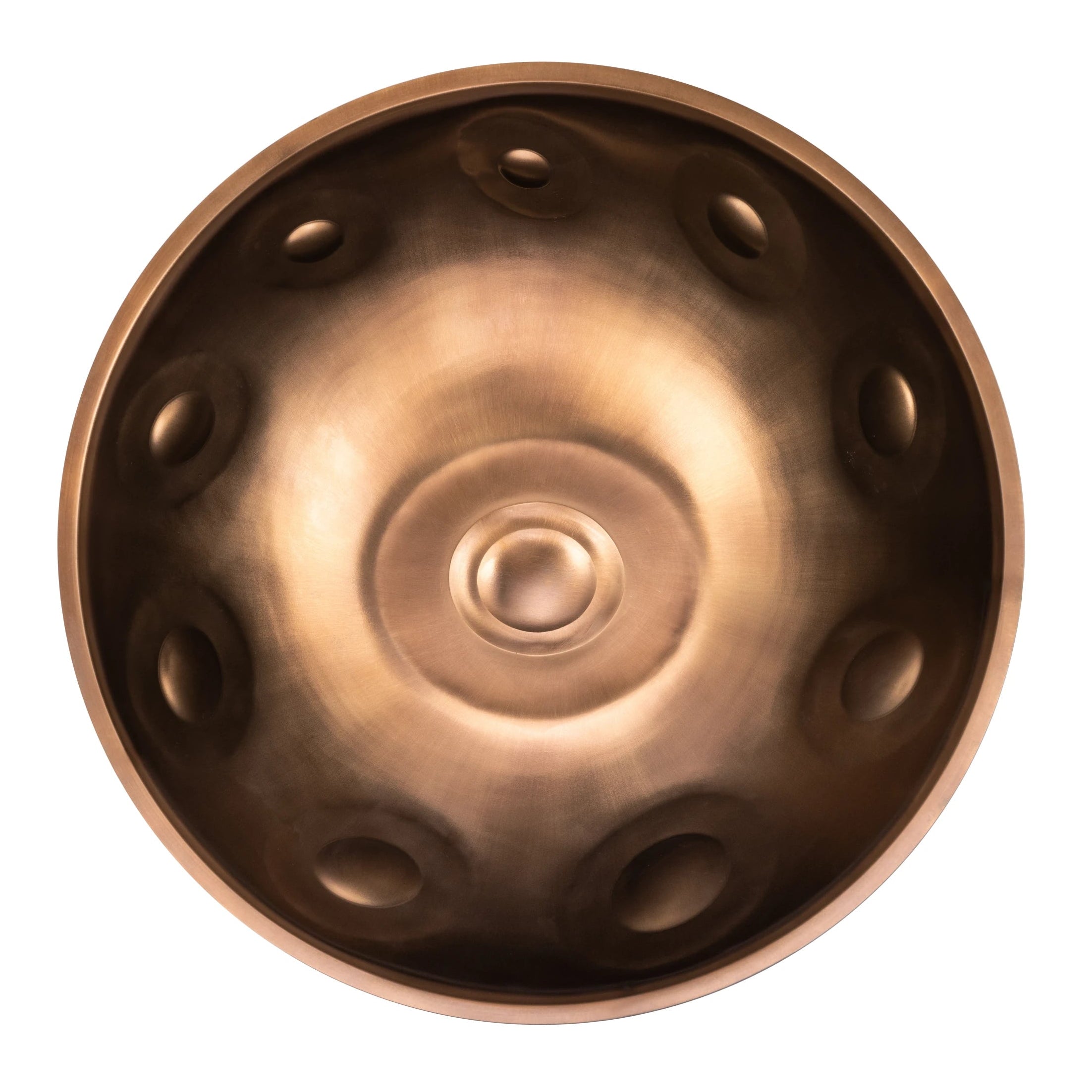 A top view of a bronze handpan, a round percussion instrument with circular indentations, isolated on a white background. Buy handpan from our Handpan Shop Germany for quality sound and craftsmanship.