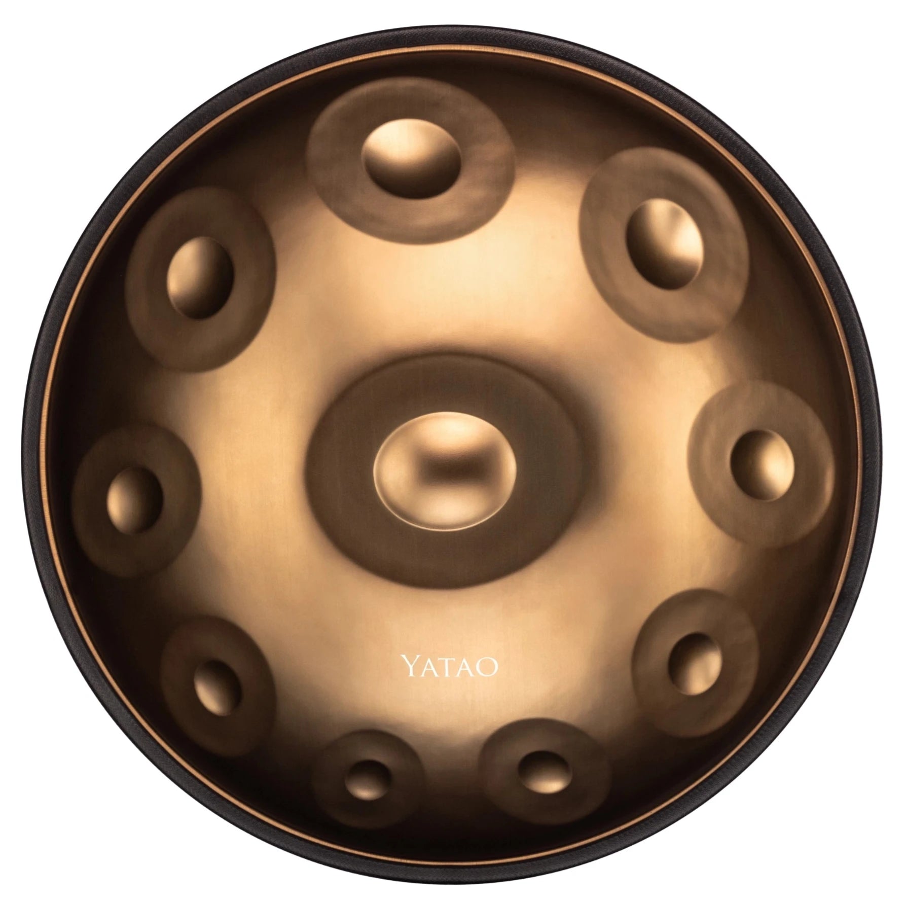  Shop is a metallic handpan with a circular bronze design, central dome, and evenly spaced indentations. YATAO is printed near the edge.