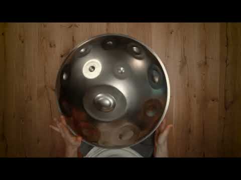 Thumbnail for Mudra D Kurd 19 Stainless Steel handpan video, featuring a silver 19-note handpan with Mudra Handpan branding on a blue background